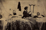 Nurse Annie Bell with patients after the Battle of Nashville. This image was used by the Sanitary Commission during its Northwest Sanitary Fair in Chicago in 1865.