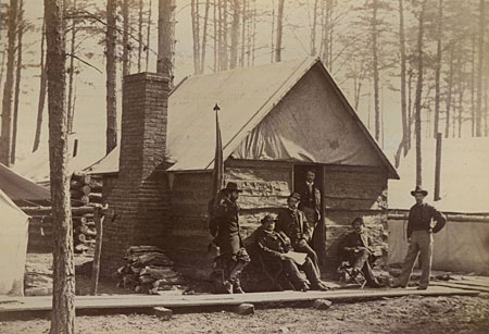 Officers generally lived in better-quality cabins than enlisted men. This cabin, built for the officers in the headquarters of the Army of the Potomac, has a well-built brick chimney and thick hewn timbers for walls.