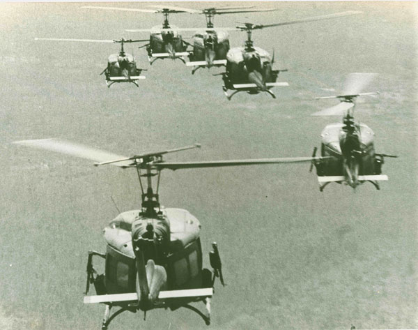 "A gaggle of Huey Slicks soars through Vietnam skies..."  The original caption on this photo refers to the attack transport Hueys used in the "airmobility" strategy and tactics