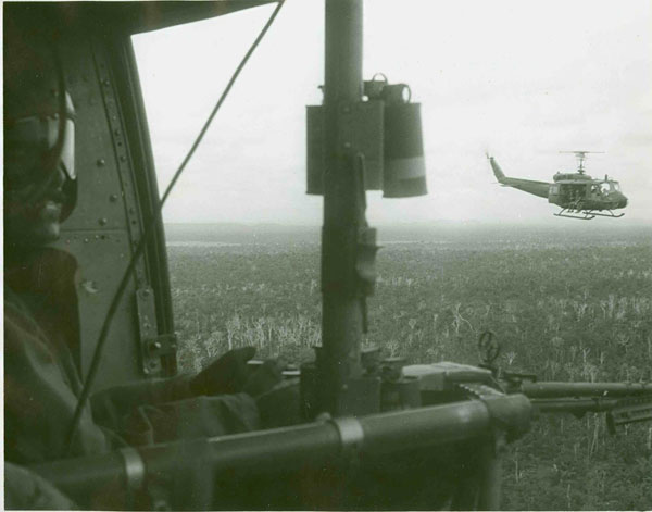 Soldiers fly back to Bien Hoa after a mission supporting an artillery outpost.  Challenging landscapes and remote location often meant Hueys provided the only way in or out of a combat zone.