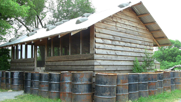 The "hootch" at the Army Heritage Trail represents the living quarters many Soldiers in Vietnam experienced. The barrels were filled with earth to protect the interior of the building