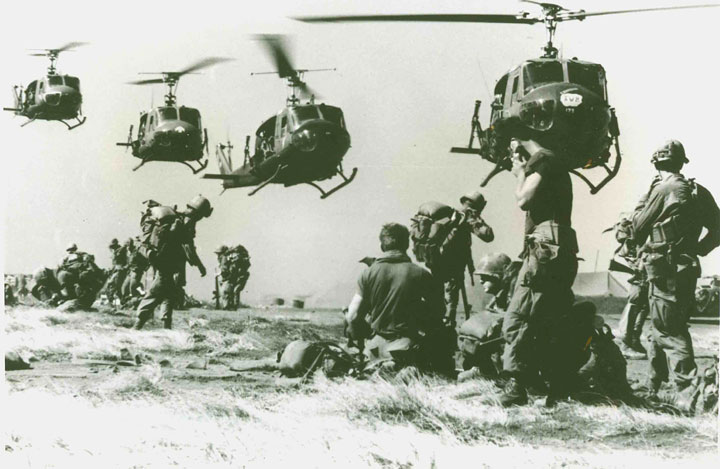Sky troopers from the 1st Cavalry Division (Airmobile) get ready to board Hueys to travel to a suspected enemy location