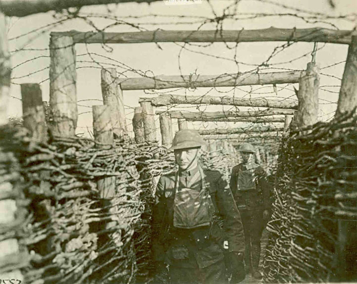 Americans from the 166th Infantry moving through Allied trenches near Blemiercy.